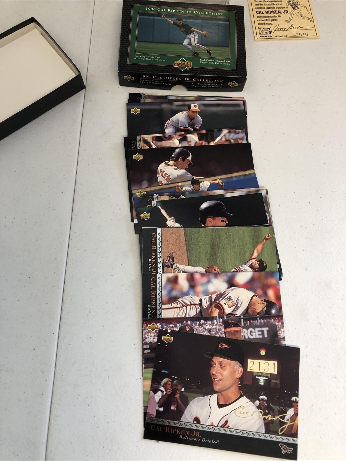 CAL RIPKEN JR COMMEMORATIVE AUTOGRAPHED BASEBALL(FASC) & 96 UPPER DECK SET