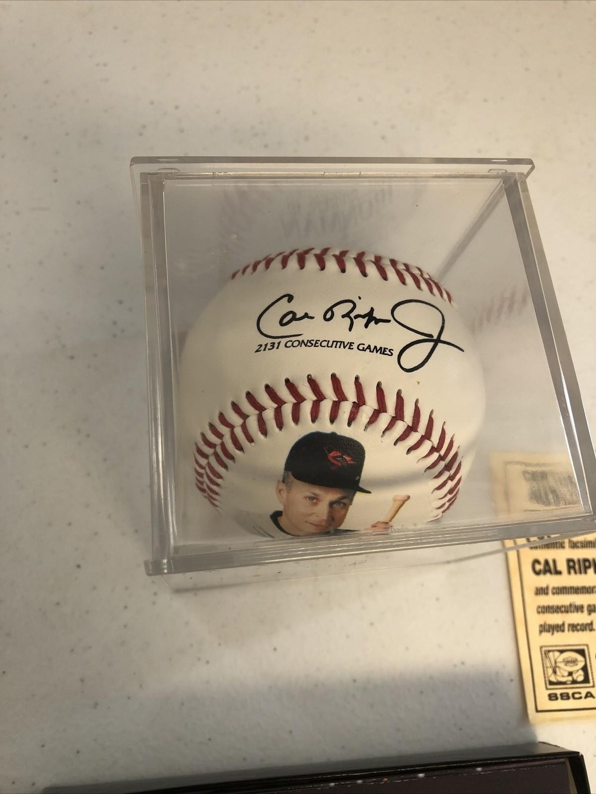 CAL RIPKEN JR COMMEMORATIVE AUTOGRAPHED BASEBALL(FASC) & 96 UPPER DECK SET