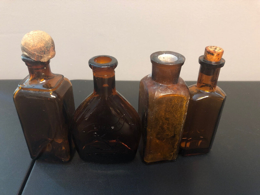ANTIQUE BROWN BOTTLES, 1 WITH ORIGINAL DABBER, 1 WITH CORK